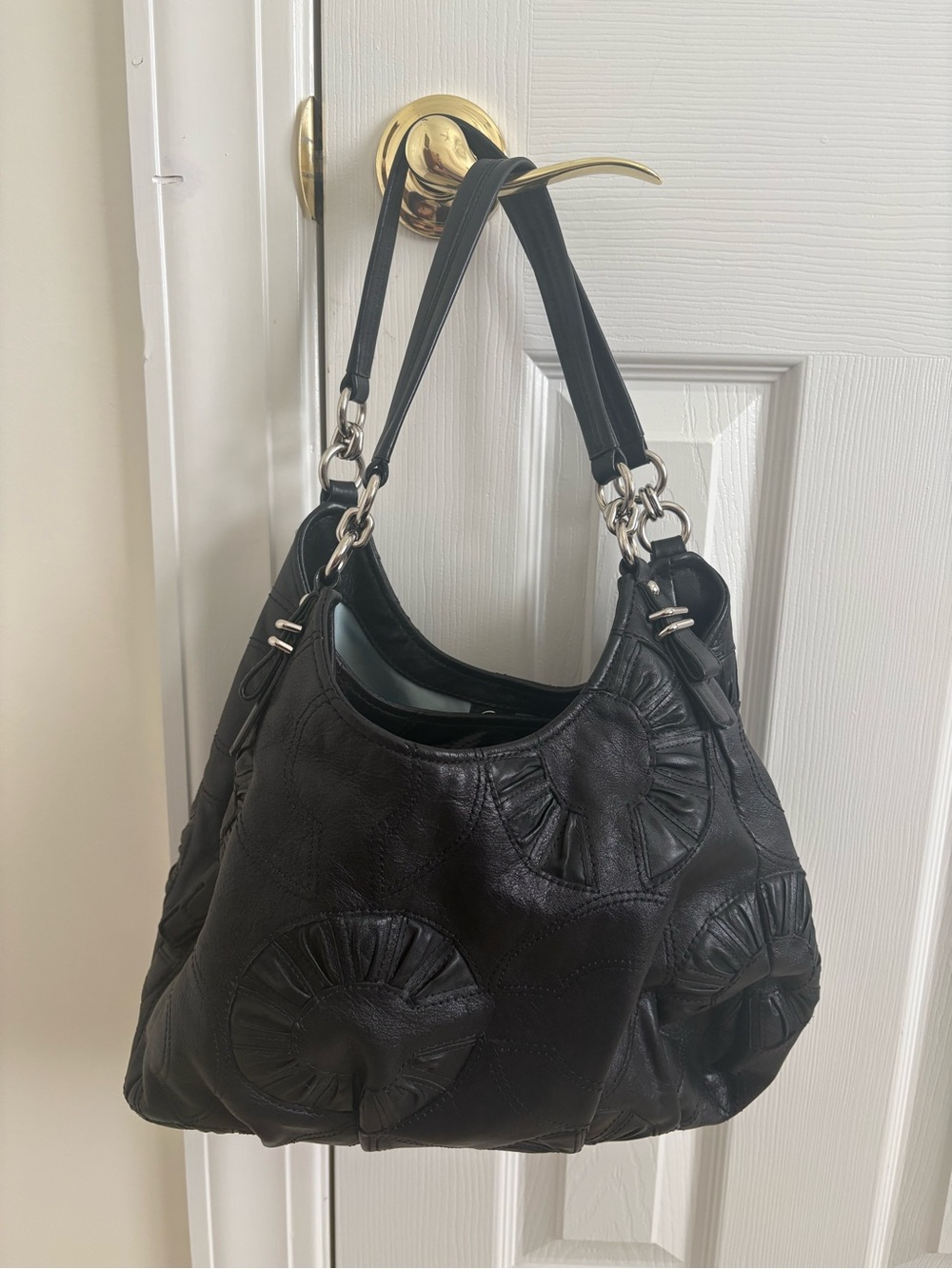 Coach Black Leather Shoulder Bag with Circular Appliqué